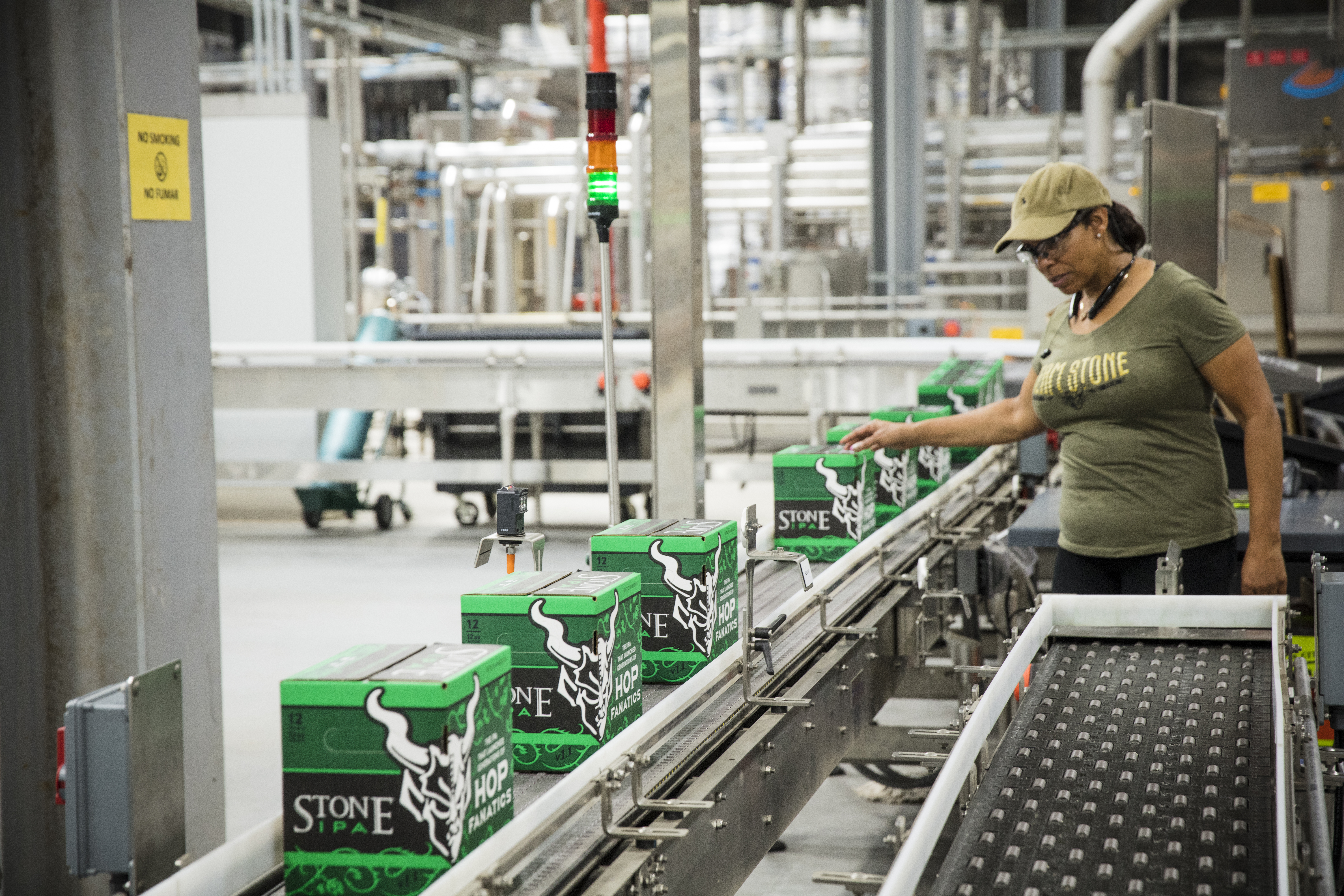 Stone Brewing Woman working inside of a factory