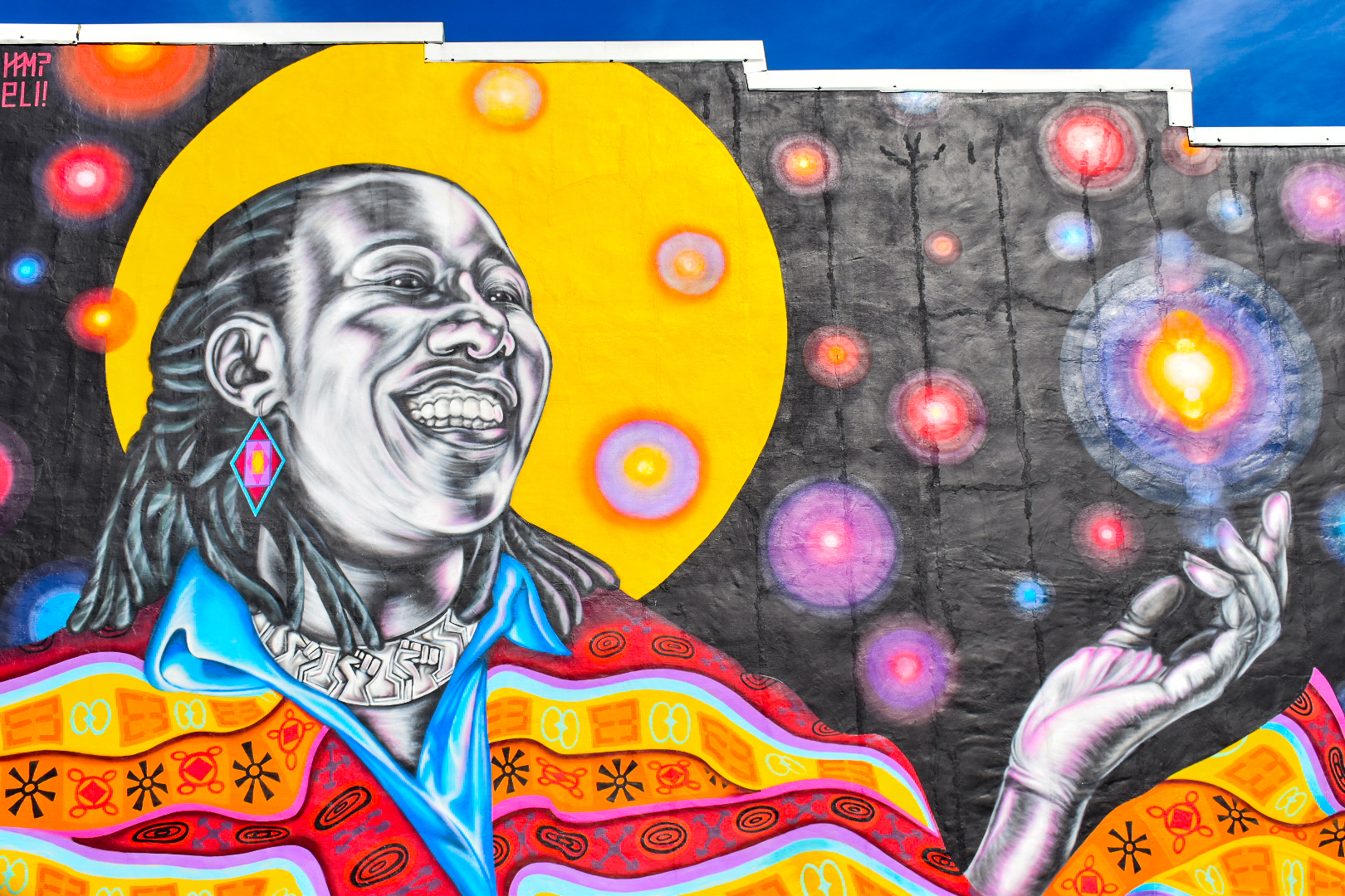 Mural of woman on the exterior of a building