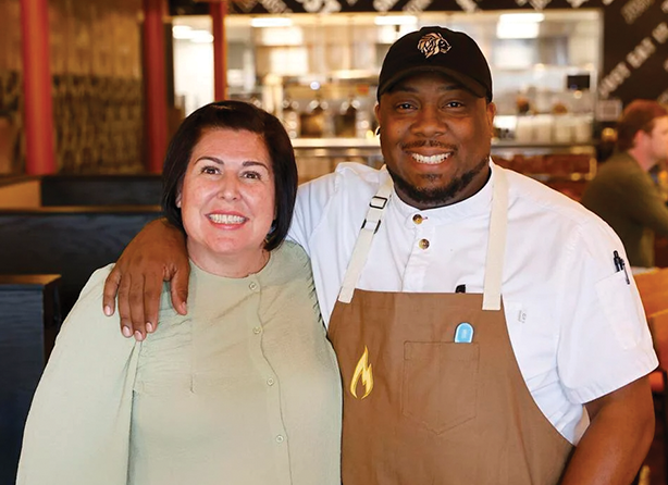 Man and woman standing in restaurant